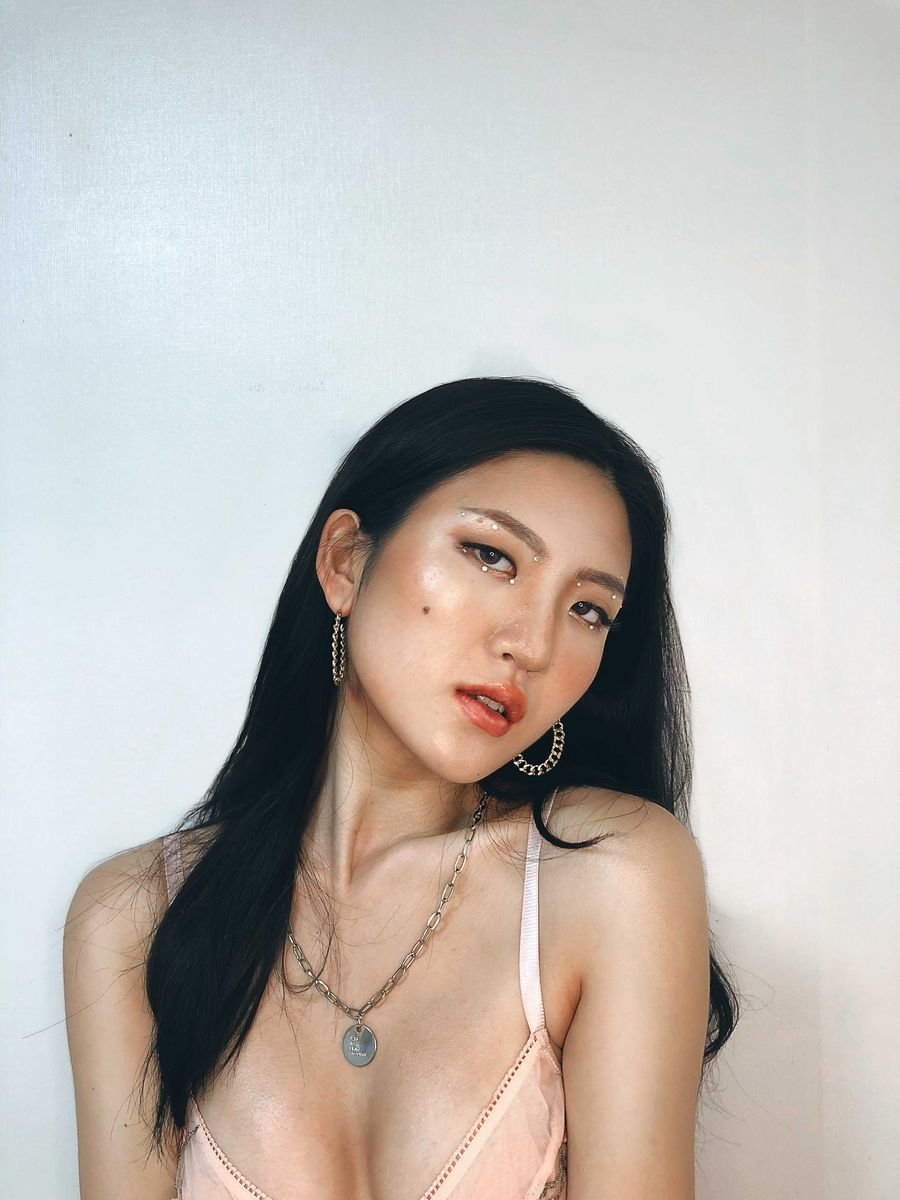 Portrait of a model against a white wall
